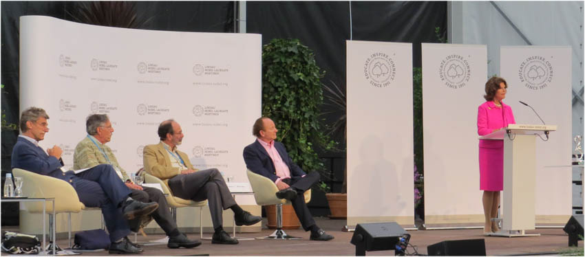 Nobel Laureates Persson, Diamond, Roth and Merton listening to Queen Silvia of Sweeden.